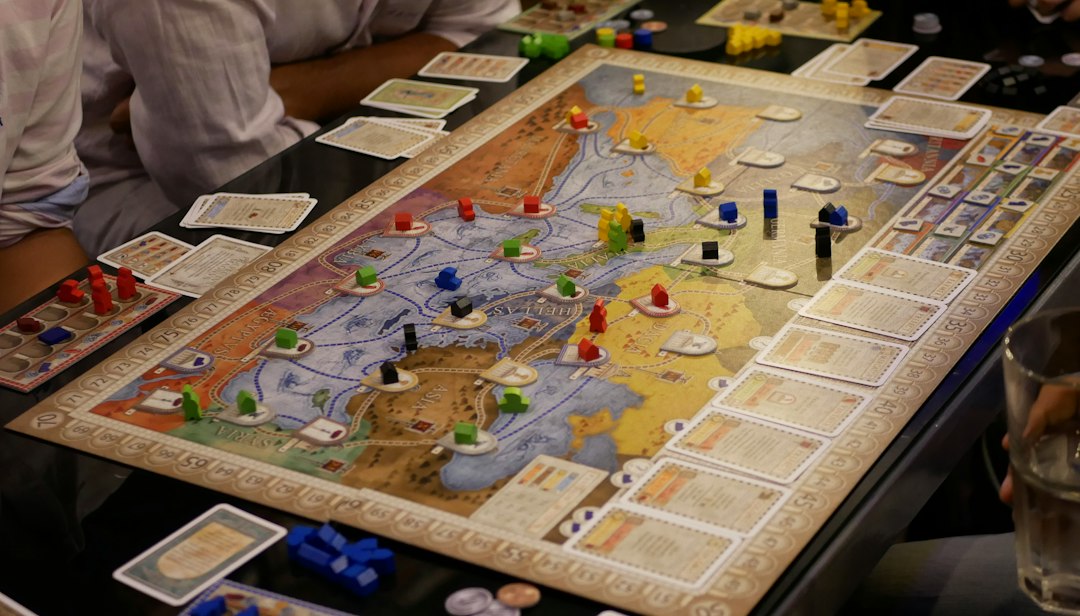 Strategy board game pieces arranged on a table