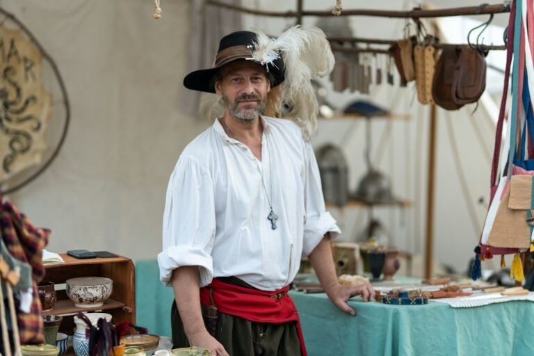 People wearing medieval festival costumes at a historical reenactment